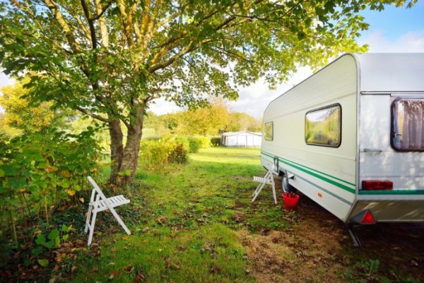 caravan in field in autumn